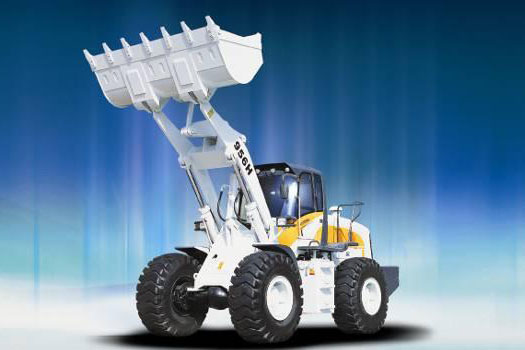 Wheel loader loading a haul truck on a material yard